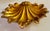 This elegant shell-shaped dish is a decorative catchall designed in the classic Florentine style, featuring a gold-leaf or...