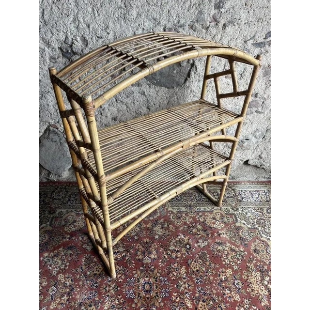Magnificent and rare Swedish rattan shelf from the 60s. This is a rounded model.