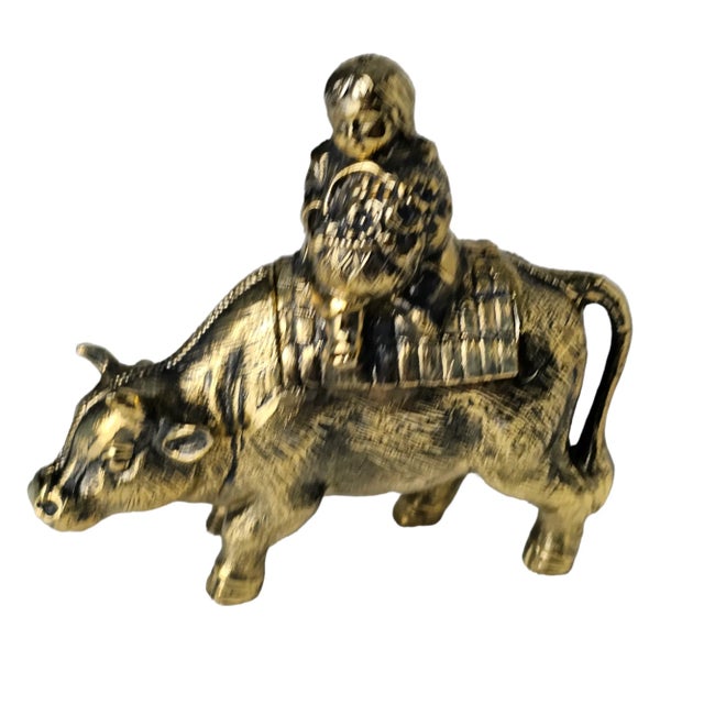 This vintage brass incense burner, featuring a charming child bull design, is a unique piece that would be a perfect...