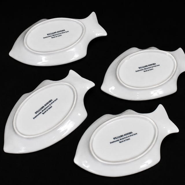 Add a stylish coastal touch to your table with this **set of 4 vintage Williams-Sonoma white porcelain fish-shaped...
