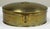 Large oval brass box featuring Asian insignia detail to domed lid. Substantial size. Nice patina. Clean interior.