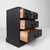 A compact Japanese drawer cabinet in traditional style, finished in dark wood with elegant black metal handles....
