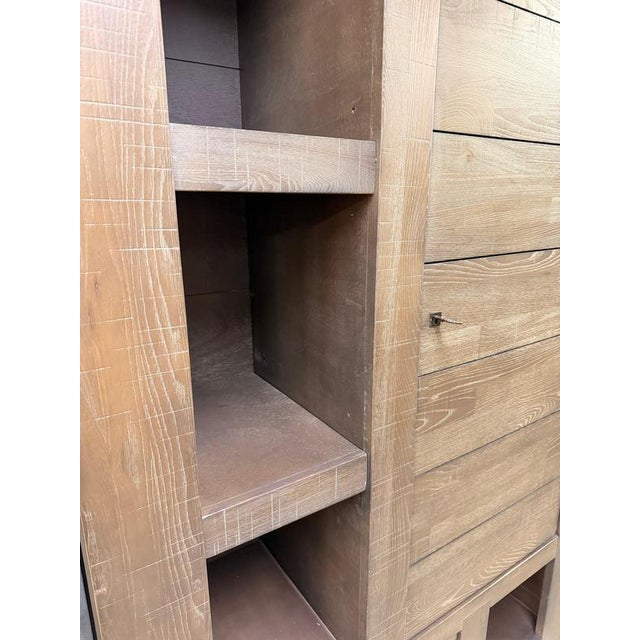 Impressive highboard by henders & hazel , crafted in solid wood with a distinctive brushed and textured finish. The warm...