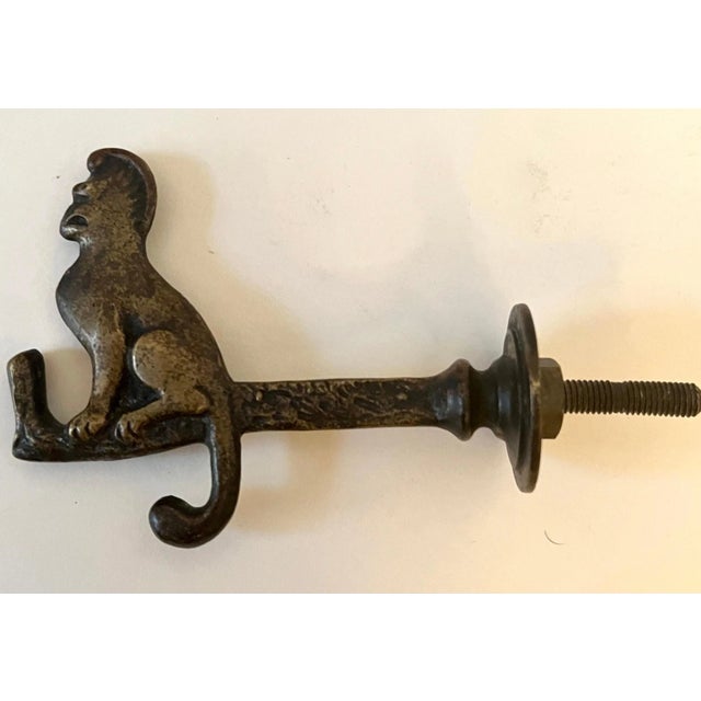 A solid brass door hook with a monkey on the end. A whimsical expression for many spaces - great for the back of a door,...