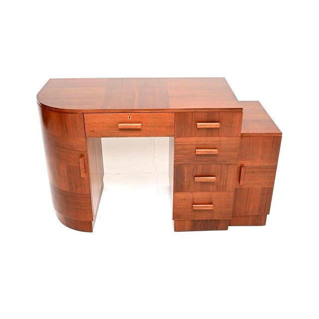 A stunning original Art Deco figured walnut desk. This was made in Aberdeen by James L. Archibald and Sons, it dates from...