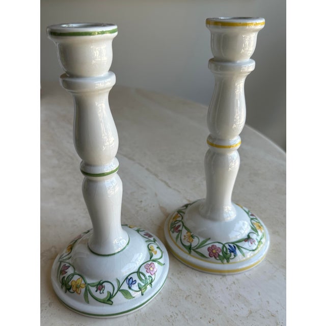 Simple and sweet hand-painted candlestick holders from Italy. Matching in style and design with one having a green rim and...