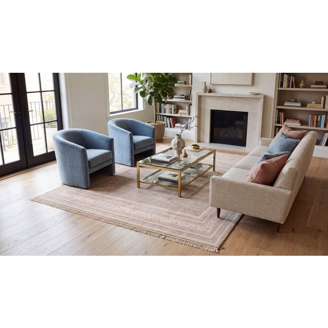 Exuding quiet luxury and exceptional artistry, this fine antique wool rug features a dense, intricate geometric...