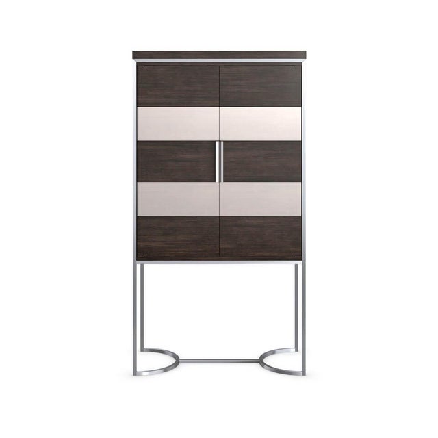 This architectural bar cabinet fuses form and function in an intriguing mix of materials and finishes. Its linear design...