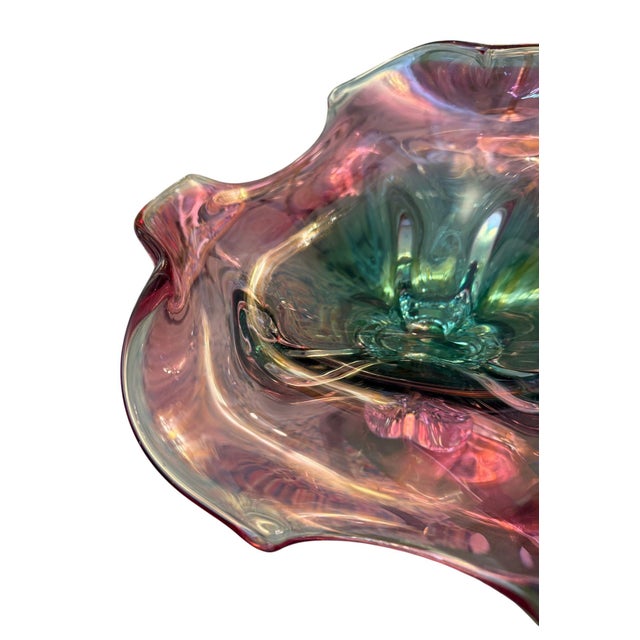 A sculptural Murano art glass footed bowl, hand-formed in a striking combination of emerald green, rose pink, and clear...
