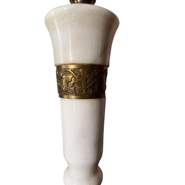 Beautiful pair of MCM era marble and brass table lamps. Both are in wonderful condition. Both lamps are also in working...