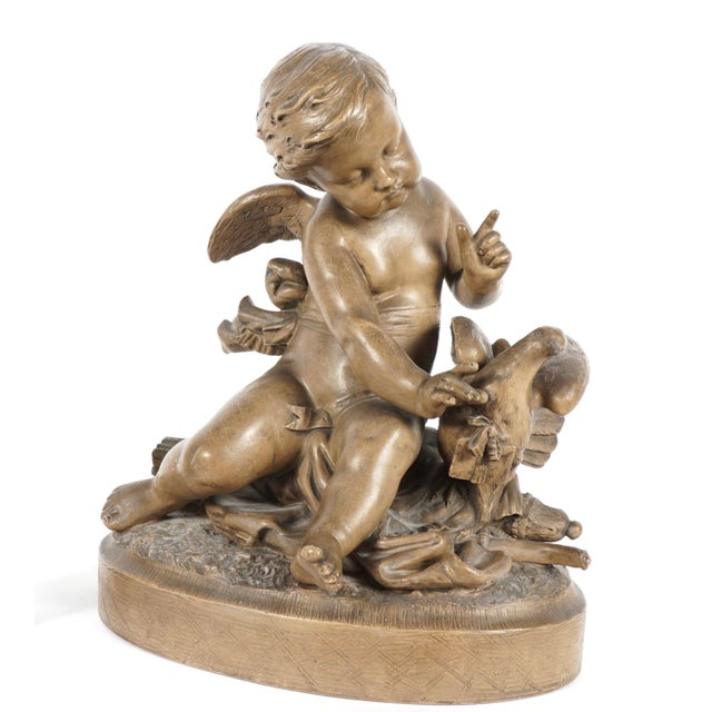 19th Century French Terracotta Figural Group of Cherub With Dove. Winged cherub is in sitting position with delicate...