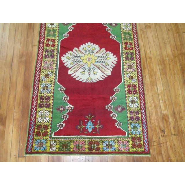 A jewel-toned turn of the 20th century Turkish runner. Measures: 3'4'' x 12'3''.