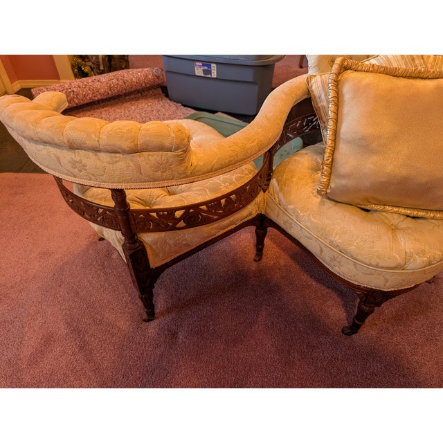 A rare and beautifully preserved late 19th-century Victorian tête-à-tête conversation sofa, crafted as a single continuous...