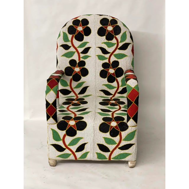 Handmade in Nigeria, these chairs are unique, all cover in beads. Seat height is 15". Measures 26" W x 23" D x 39" H with...