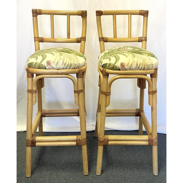 Great pair of McGuire Style barstools from the 1980's. They are made of sturdy rattan with wrapped cane joints in natural...