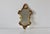 An Italian Rococo–style giltwood style molded acrylic polymer wall mirror. Richly styled with scrolling acanthus and shell...