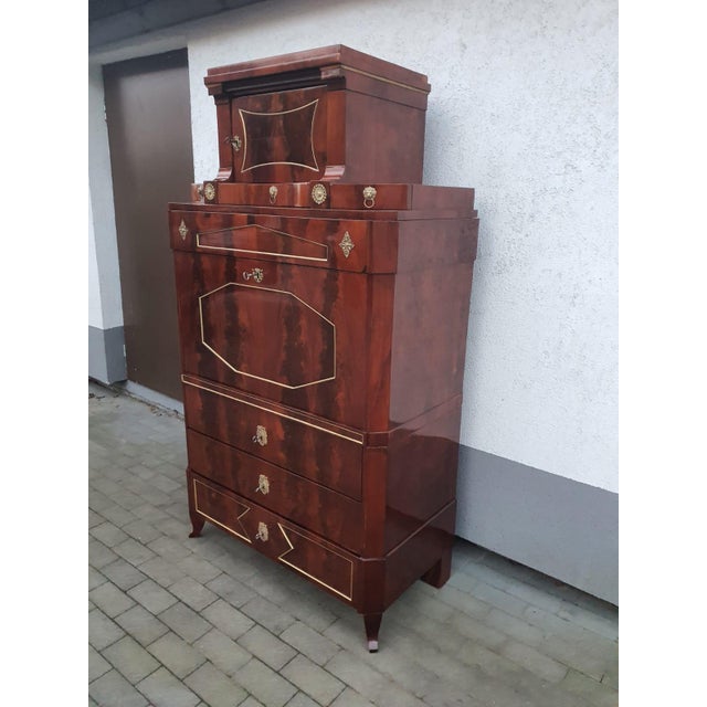Three-part original secretary desk with a beautiful upper section, including three narrow drawers, a further large drawer,...