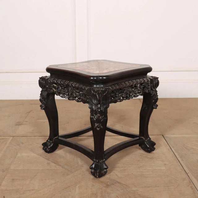Late 19th C Chinese carved elm/marble side table. 1890 This piece is designed in the style of the selected designer and/or...