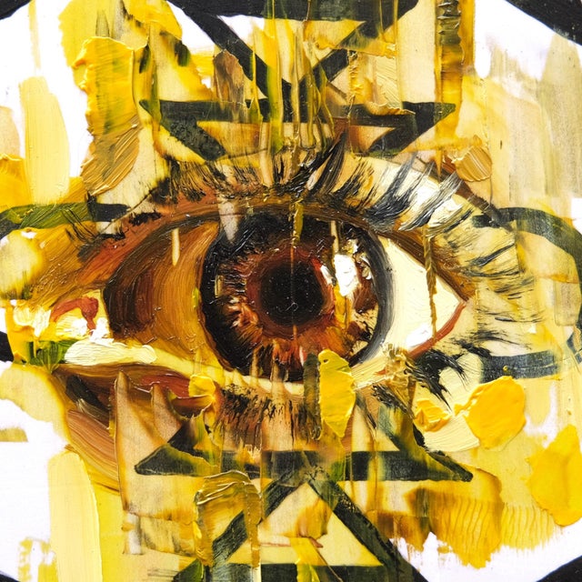 This artwork features a striking eye at its center, surrounded by bold geometric patterns that create a sense of depth and...