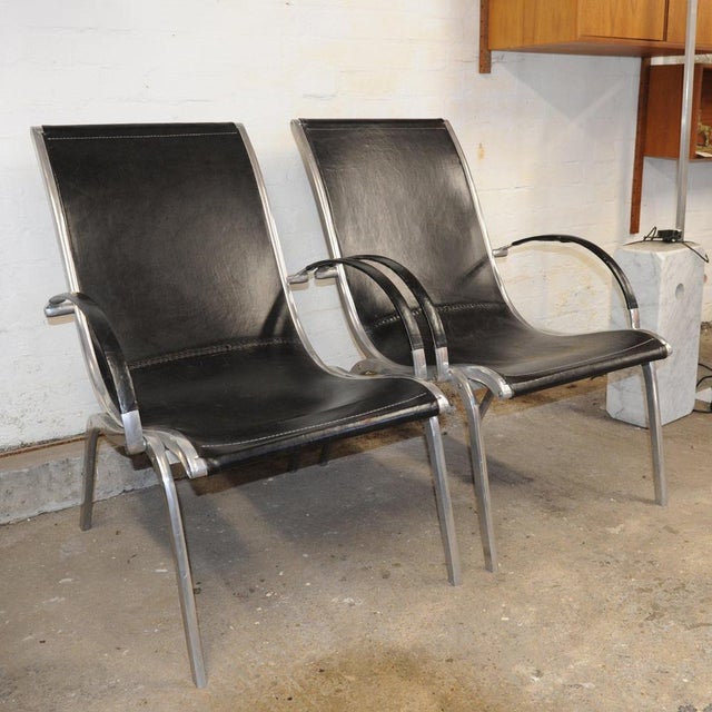 A striking pair of mid-century lounge chairs by Rudolf Szedleczky , dating from the 1970s. These sculptural chairs feature...