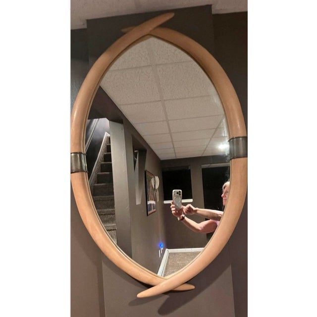 Embrace the vintage glamour of the 1970's with the Chapman Faux Elephant Tusk and Brass Wall mirror. This mirror enhances...