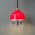 This pendant lamp was designed and produced in Spain during the 1970's. It features a red acrylic lampshade, with white...