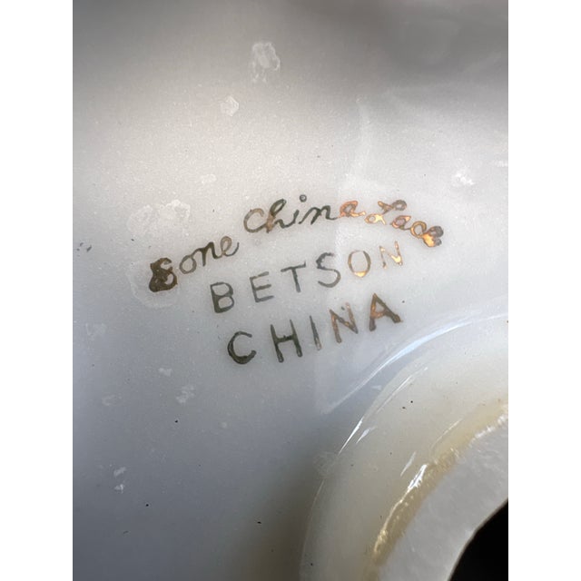 A charming pair of vintage figurative table lamps featuring a dancing couple rendered in richly glazed porcelain, inspired...