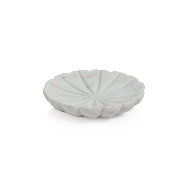Beautifully formed, scalloped ruffles surround the edges and create the organic forms of these stunning marble dishes...