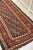 Name: Daisy Size: 3.6 x 11 Age: Antique Pile: Low with patina About: Beautifully old and charming boteh design runner....