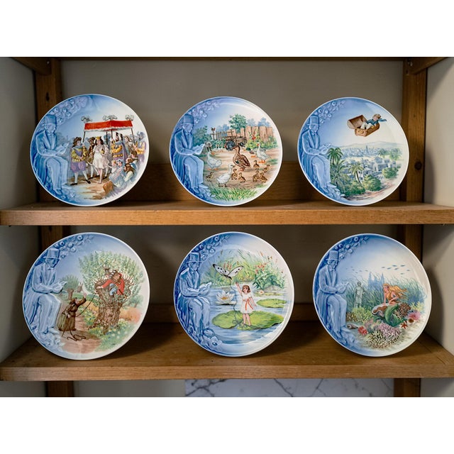 A set of six small collectible plates from Bing & Grondahl dedicated to Hans Christian Andersen's fairy tales. Each plate,...