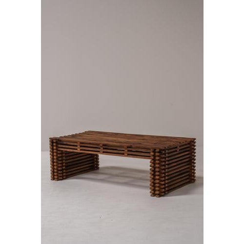 Beautiful vintage coffee table featuring a striking slatted wood construction with a sculptural, architectural form. The...