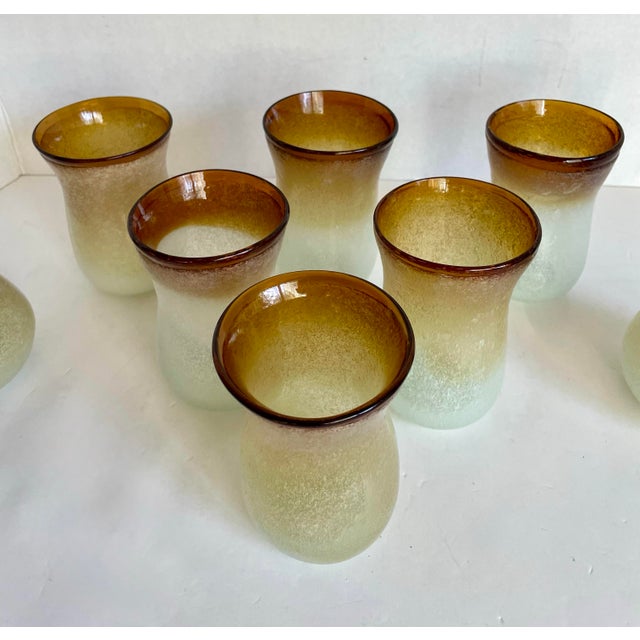 This striking vintage hand-blown art glass barware set includes six sculptural drinking glasses along with two matching...