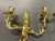 Beautiful gilt-bronze candle sconces from the Hollywood Regency era. Neoclassical detailing each with a male and female...