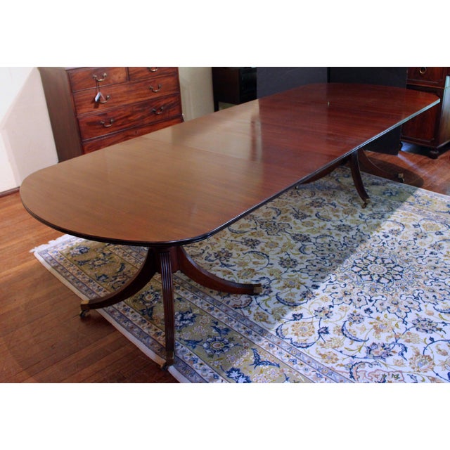 Early to mid-20th century English double pedestal dining table. High quality, rich mahogany timbers and craftsmanship. Two...