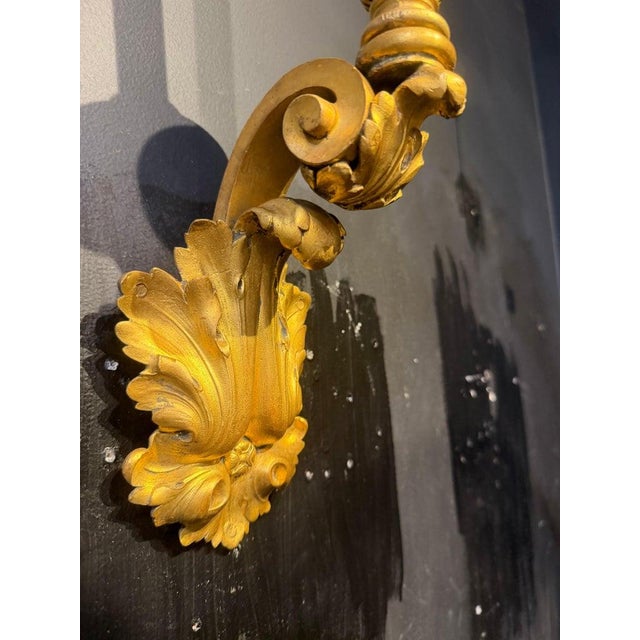 Pair of 1900’s Caldwell gilt bronze one light sconces with acanthus leaves design