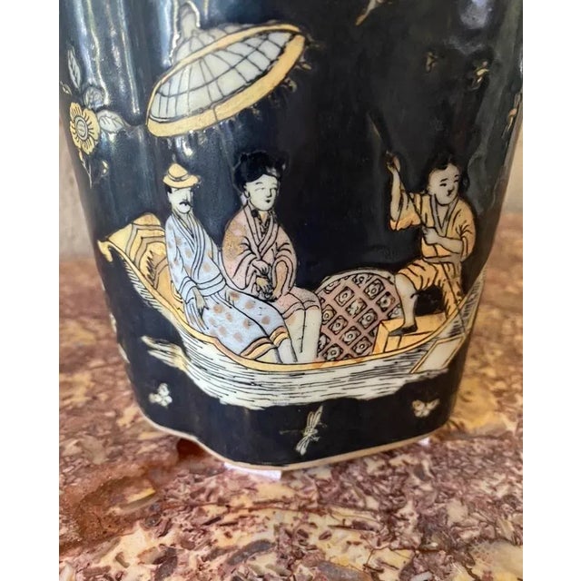 Famille noir Qing style, porcelain vase, featuring an overall Quatrefoil design, decorated with domestic and Riverside...