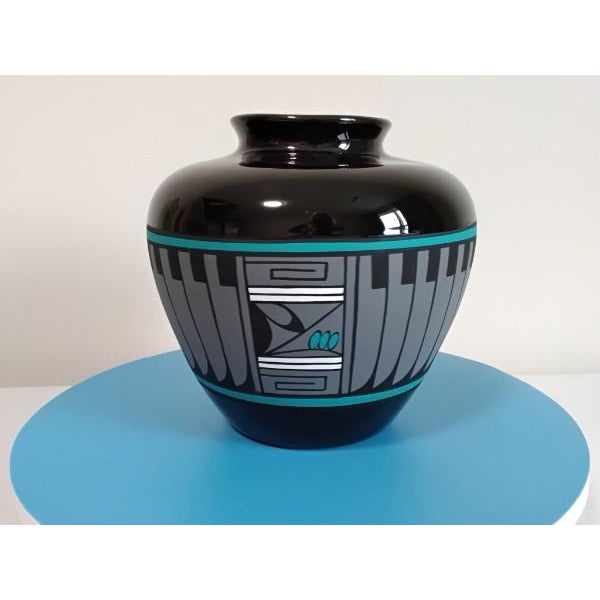 Standing at a substantial 8.75 inches in height with a broad 9-inch diameter, this oversized Olla by the Arizona "Kopa"...