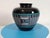 Standing at a substantial 8.75 inches in height with a broad 9-inch diameter, this oversized Olla by the Arizona "Kopa"...