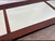 A substantial antique three-panel mantel mirror featuring original aged mirror glass set within a handsome dark brown...