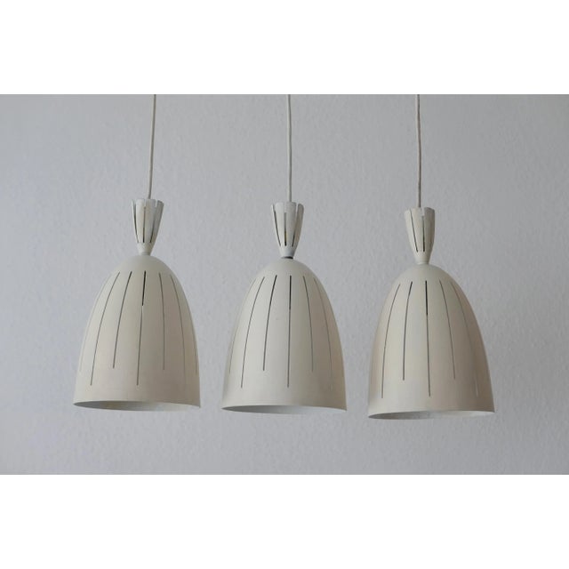 - Set of three extremely rare and elegant mid-century diabolo pendant lamps - Designed and manufactured probably in the...
