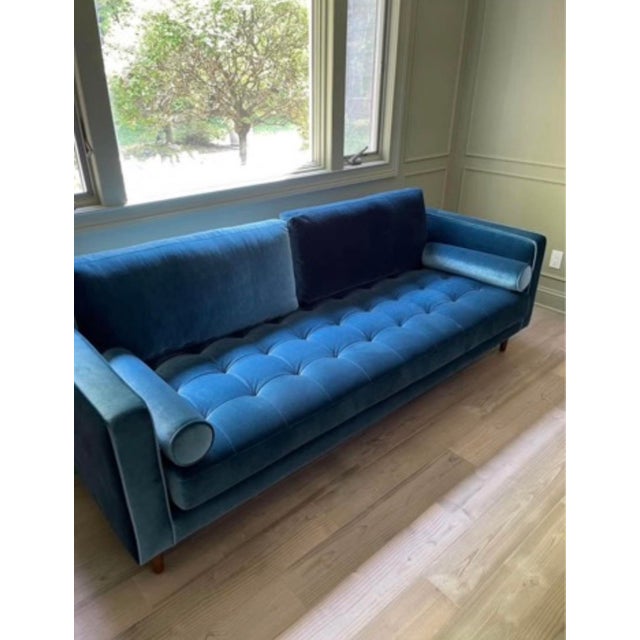 Details: • Brand: Rove Concepts • Model: Luca Sofa • Color: Blue velvet • Tufted bench seat with two back cushions •...