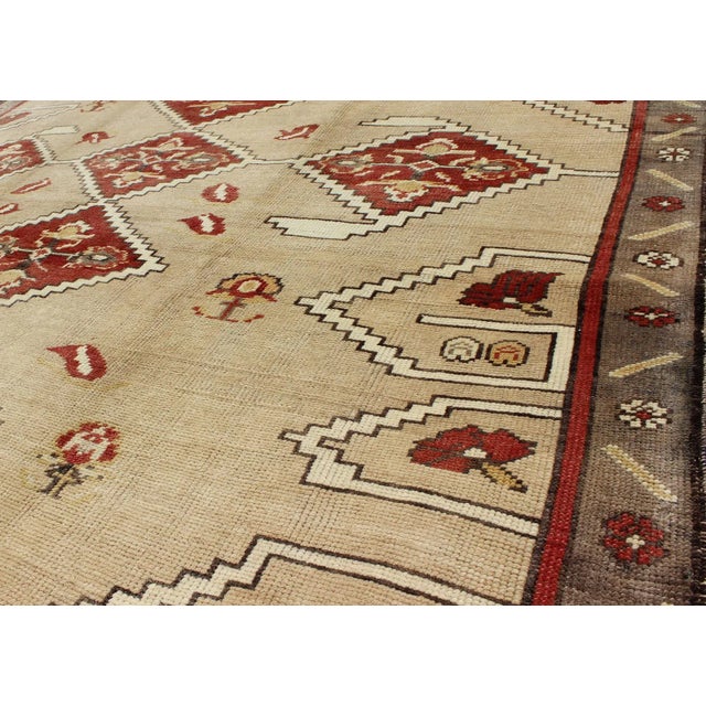 Textile Vintage Turkish Oushak Rug With Bold Diamond Medallions in Red and Beige For Sale - Image 7 of 9
