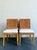 This elegant set of four vintage dining chairs showcases the enduring appeal of mid-20th-century design, thoughtfully...