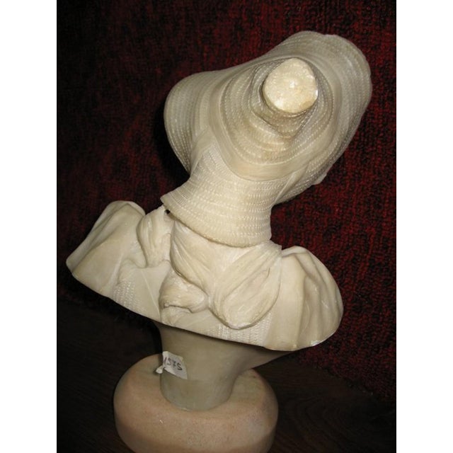 Cod. 1575 bust of a young girl. Marble sculpture. Early 20th century white carrara marble sculpture, depicting the bust of...
