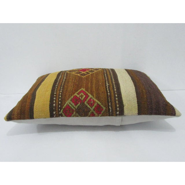 Handmade decorative pillow cover made from a vintage Turkish kilim rug. Backed with good quality cotton fabric. Pillow...