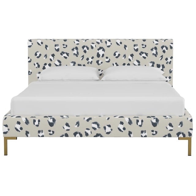 This low profile fully upholstered platform bed is a perfect piece for anyone looking to add a modern statement piece to...