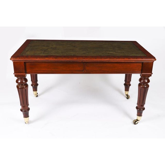 A superb antique william iv flame mahogany writing table, circa 1835 in date. The rectangular top features a moulded edge...