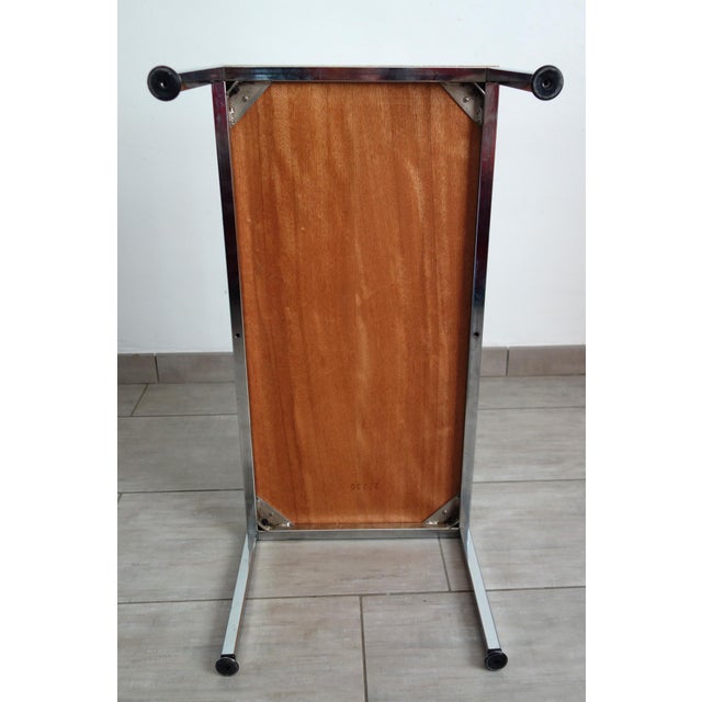 Set of 2 side tables from the 70s. Chromed metal base, white melamine top. Good quality and good condition overall....