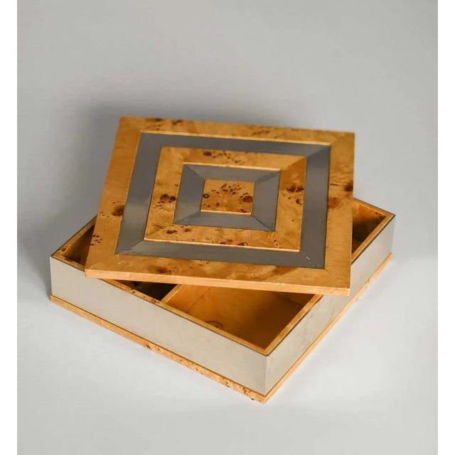 Square box in wood root and chromed metal. Italian 70s production attributed to Tommaso Barbi. Made for "Gucci Boutique"...