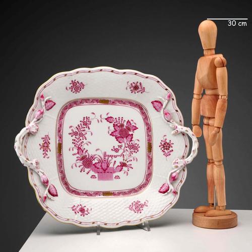 Porcelain tray decorated with a basket of flowers and plant motifs in deep pink tones and gold highlights. Handles shaped...